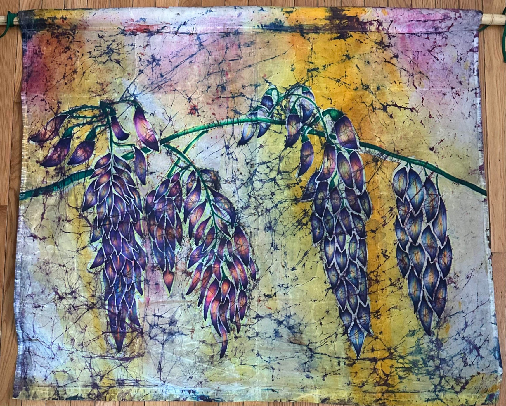 Wisteria — a batik textile with flowing purple and blue floral motifs